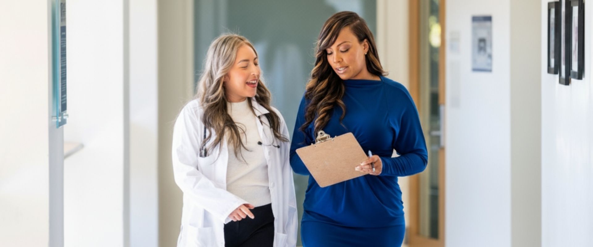 Two doctors in a hospital hallway